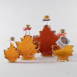 Maple leaf glass bottles filled with Fuller's pure maple syrup
