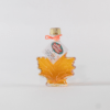 Fuller's Sugarhouse Pure NH Maple Syrup in a glass leaf bottle
