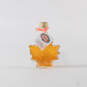 Fuller's Sugarhouse Pure NH Maple Syrup in a glass leaf bottle