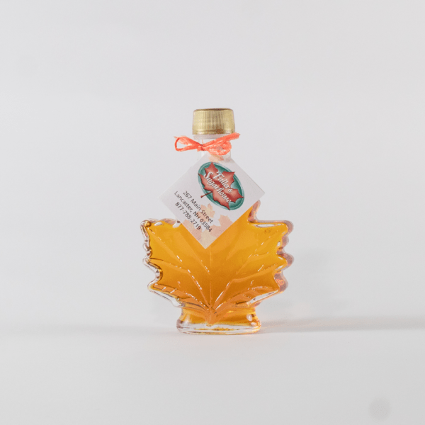 Fuller's Sugarhouse Pure NH Maple Syrup in a glass leaf bottle
